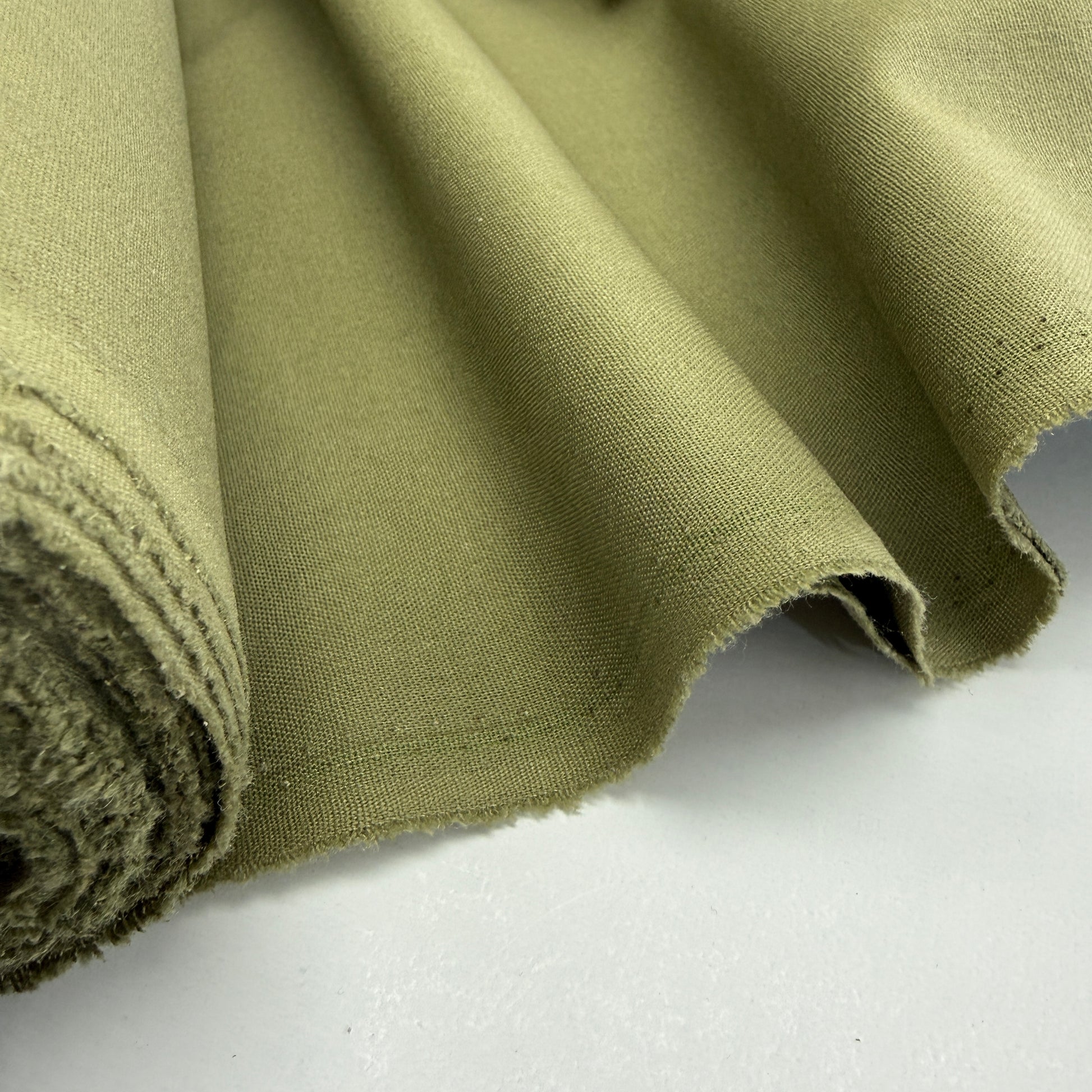 Linen + Viscose + Poly Mix fabric in Spring Green, showcasing its soft texture and breathable qualities, ideal for dresses, blouses, and home decor.